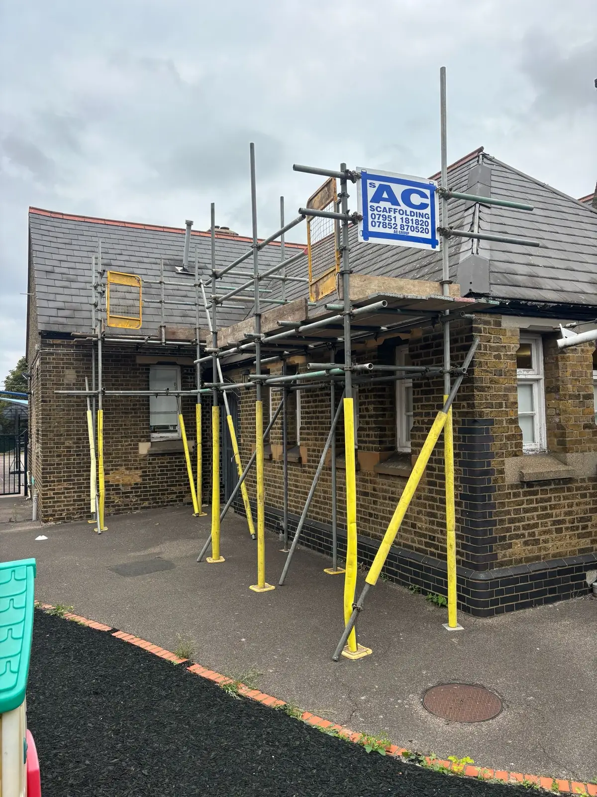 School roof repair scaffolding with safe working access in Hornchurch