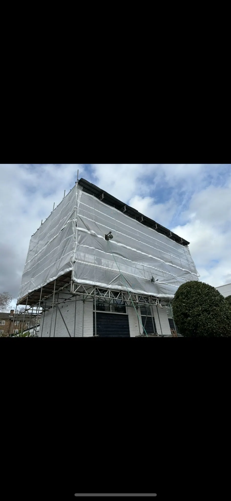 Temporary roof and shrink-wrap scaffold for a storey extension in St John's Wood